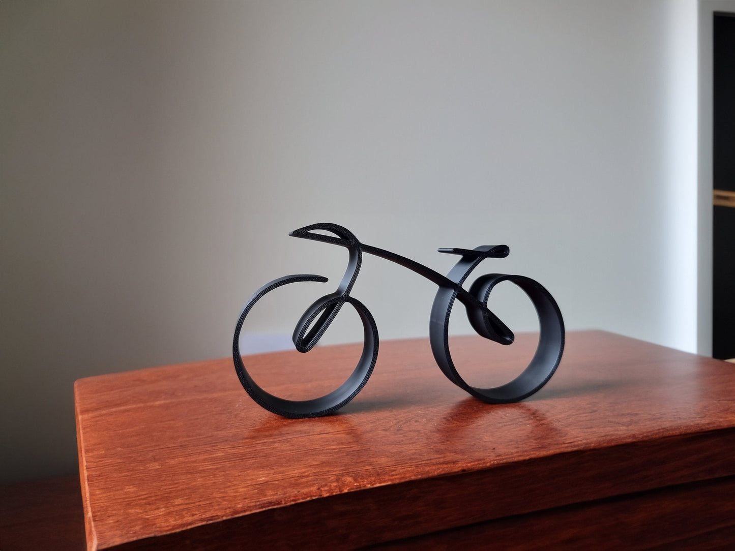 Wearclo | Elegant minimalist bicycle sculpture wireframe style